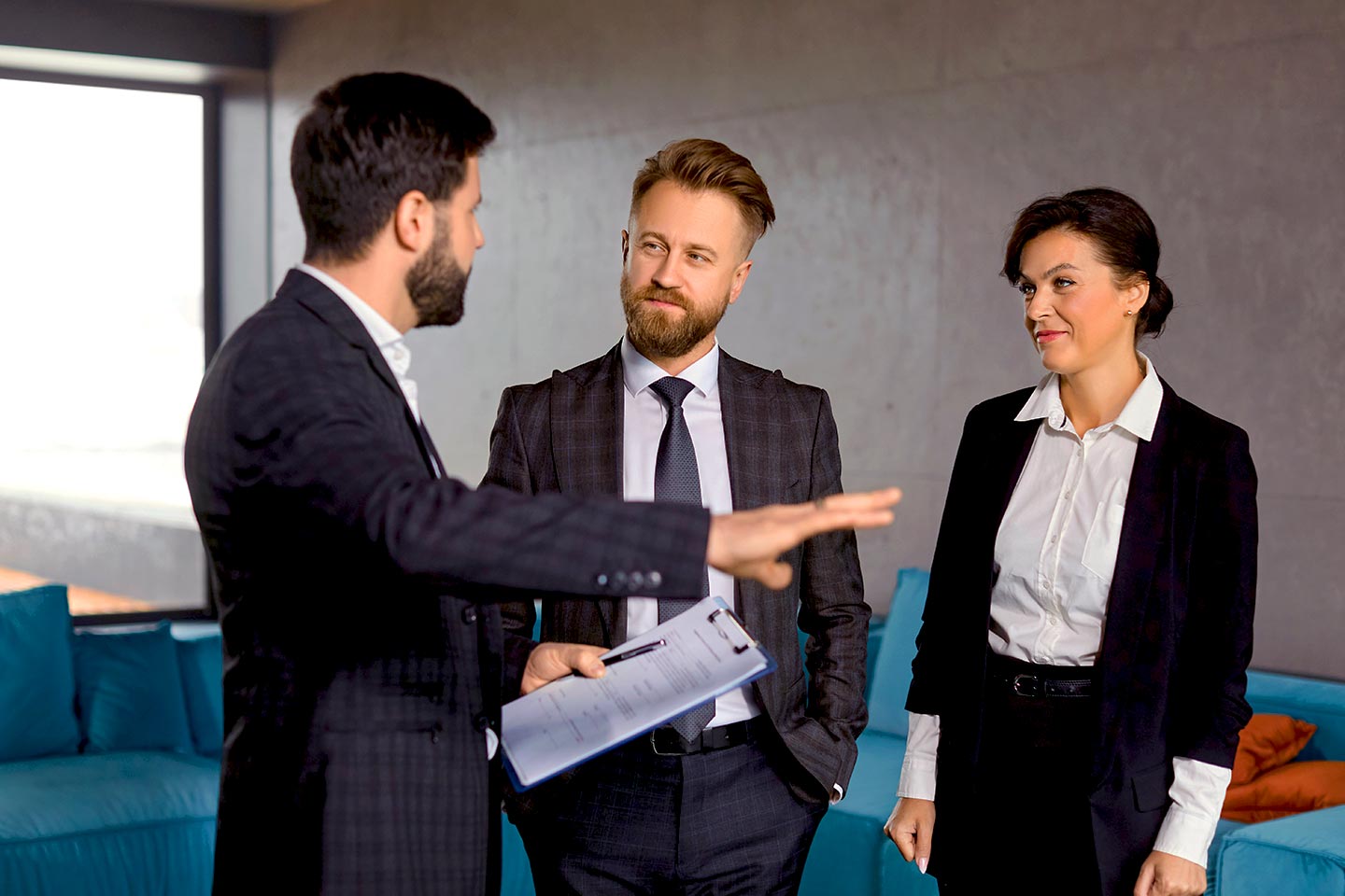 Man explaining a project to two other people
