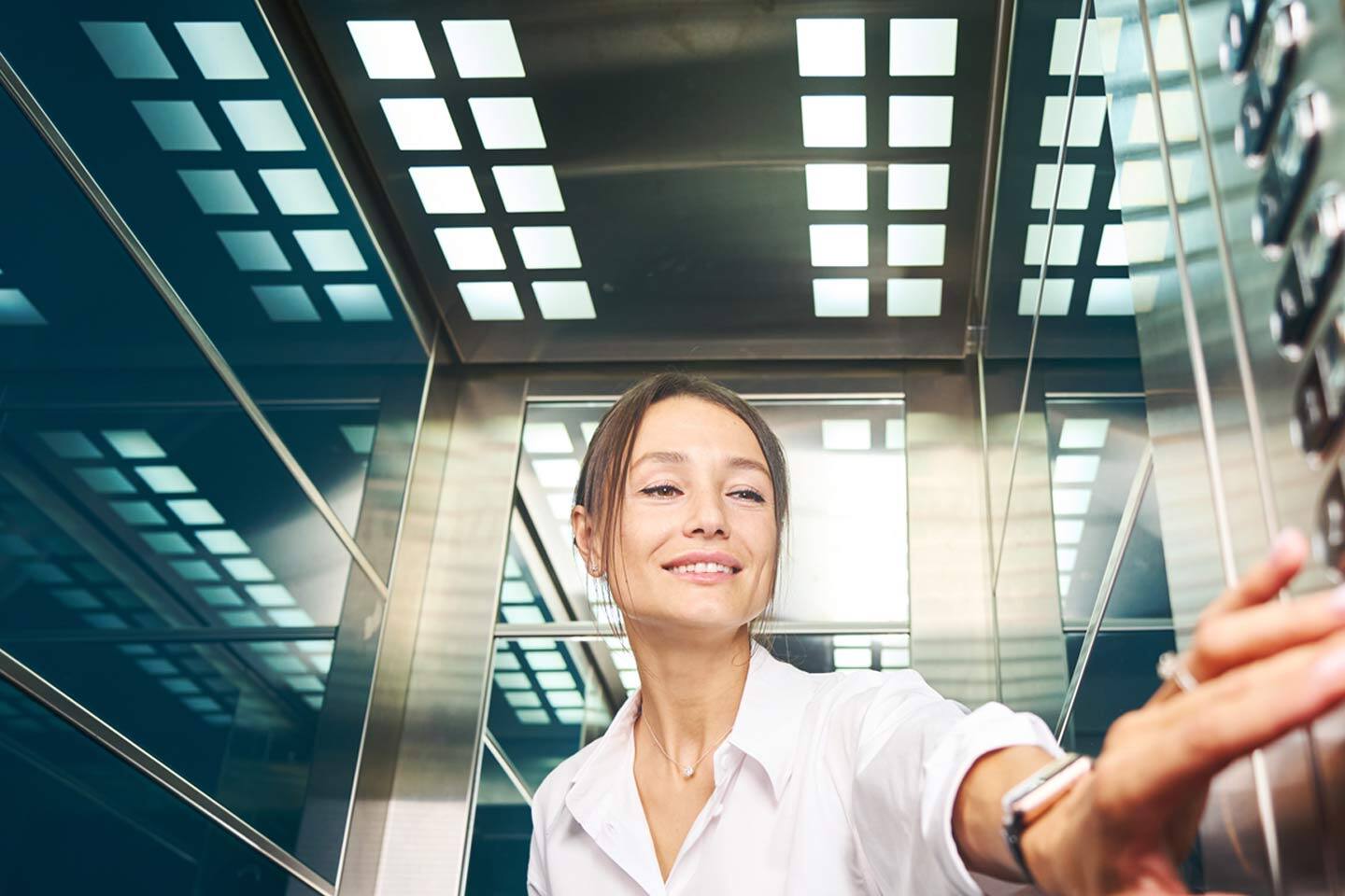 hotel manager in an elevator