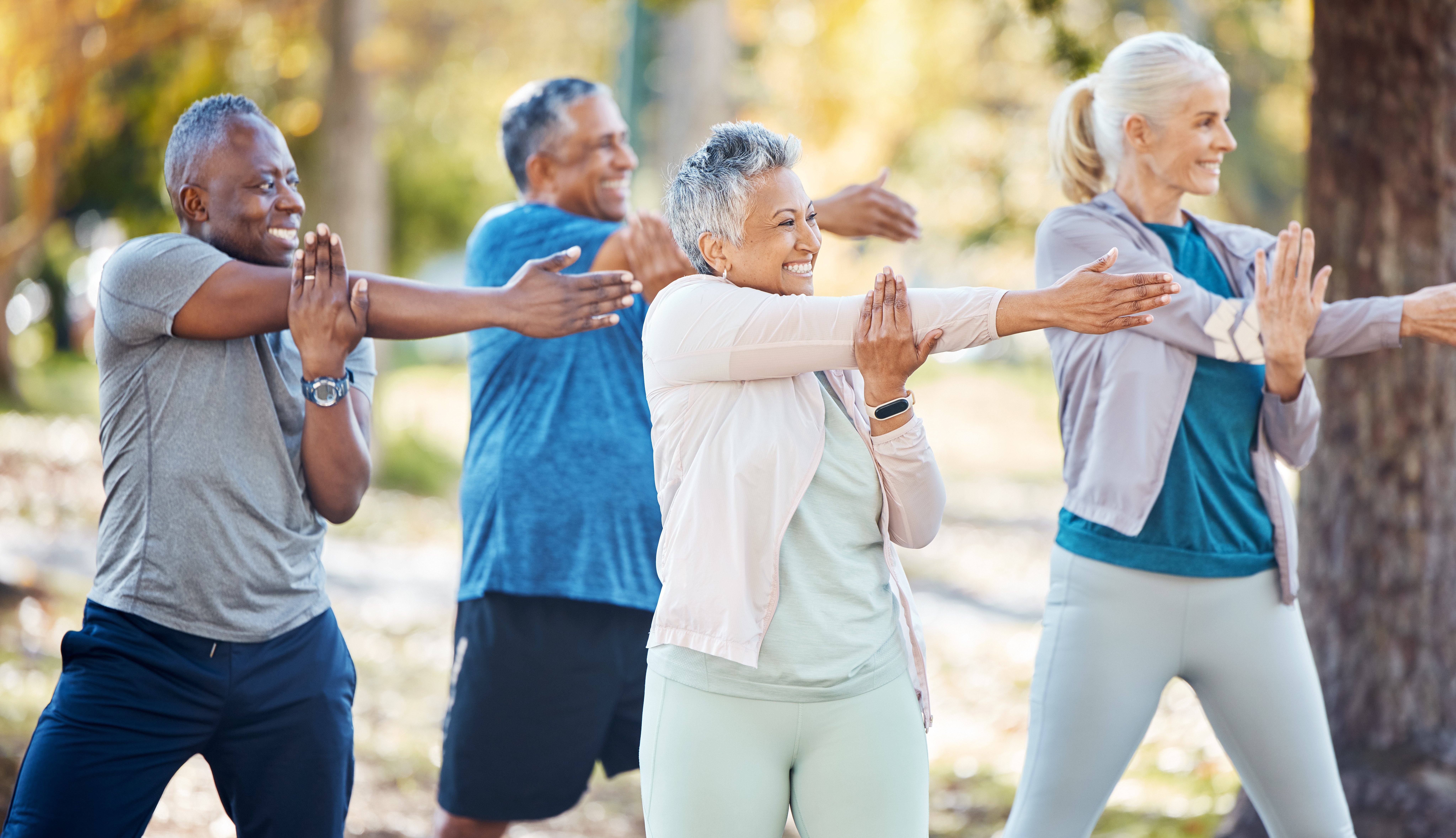 A group of active seniors stretching outside
